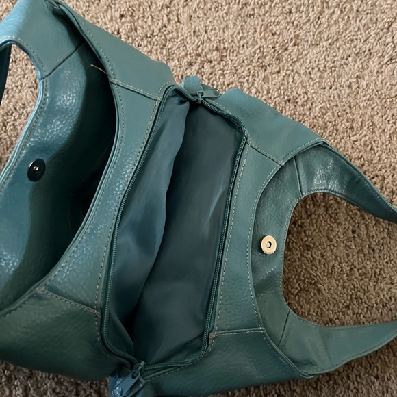 Turquoise colored shoulder bag. Has separate inside compartments. 13” X 9”. - Picture 4 of 5